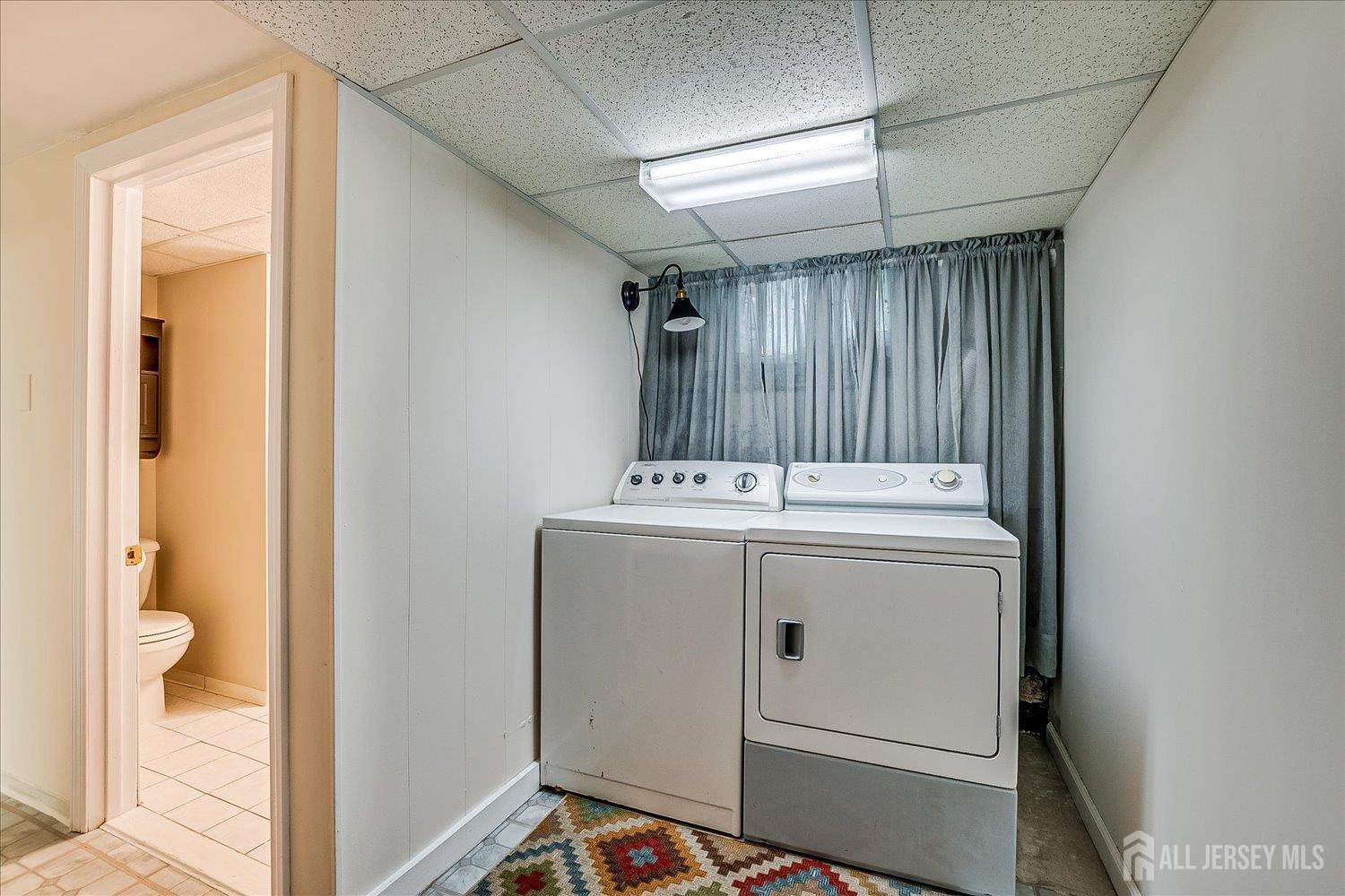275 Hoover Avenue Edison, NJ 08837 - Photo 29 of 32 a utility room with dryer and washer