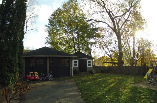 55 Ravine Road Medford, MA 02155 - Photo 2 of 8 a front view of a house with a yard and trees