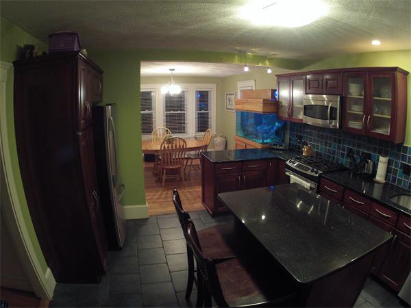 55 Ravine Road Medford, MA 02155 - Photo 8 of 8 a kitchen with stainless steel appliances granite countertop sink stove and refrigerator