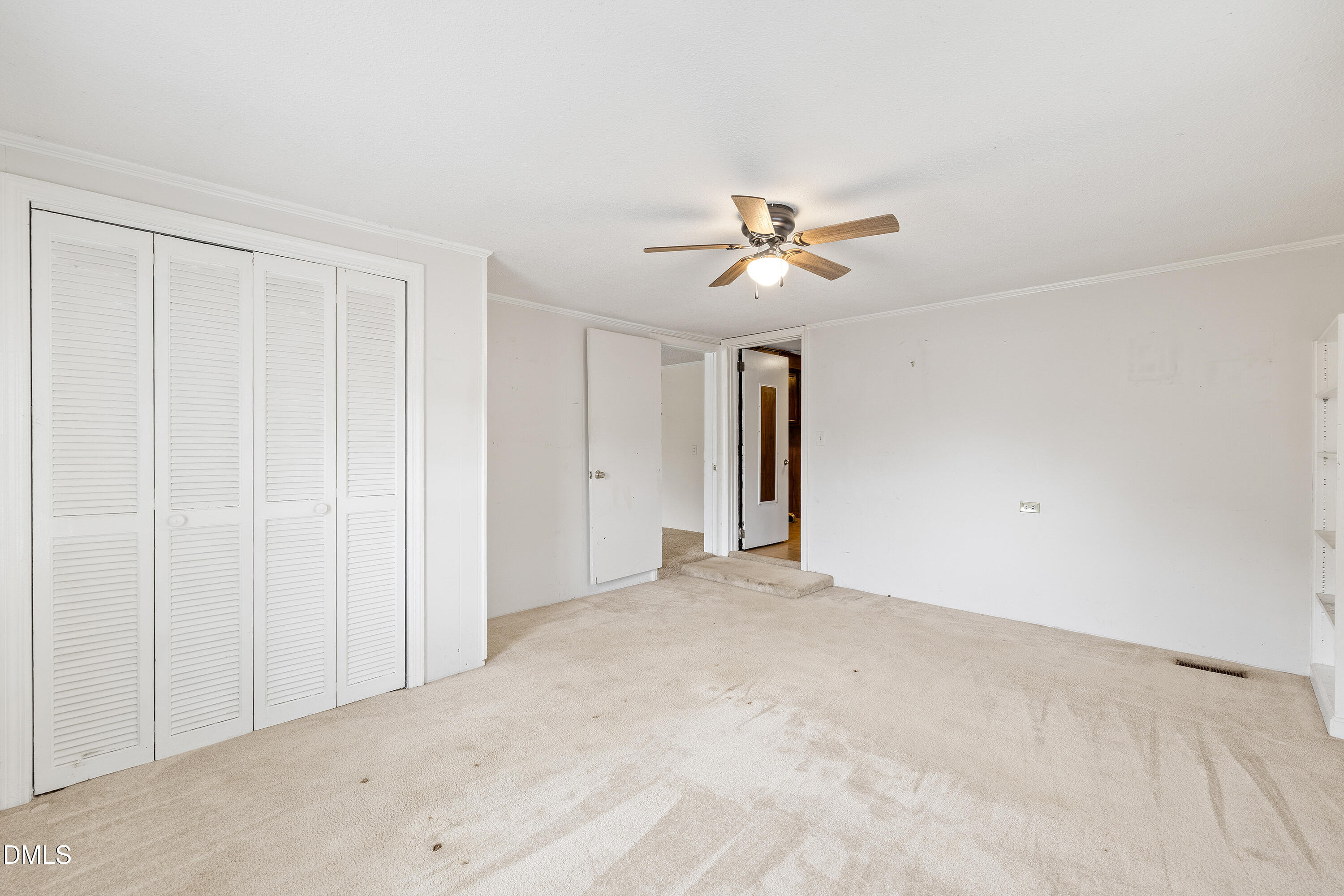 821 Penny Road Angier, NC 27501 - Photo 11 of 25 a view of a livingroom with a chandelier fan and window