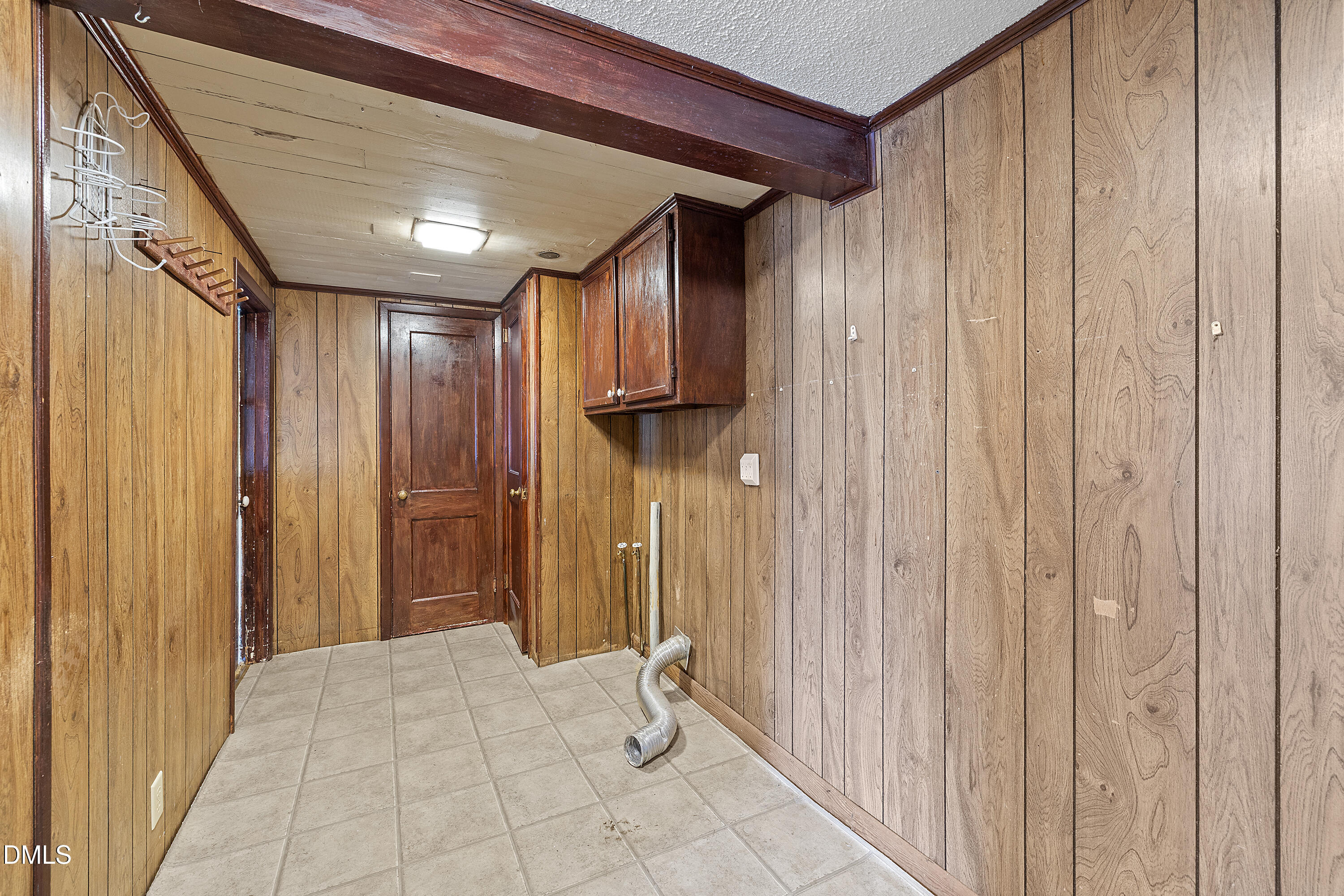 821 Penny Road Angier, NC 27501 - Photo 17 of 25 a view of a hallway with wooden shelves