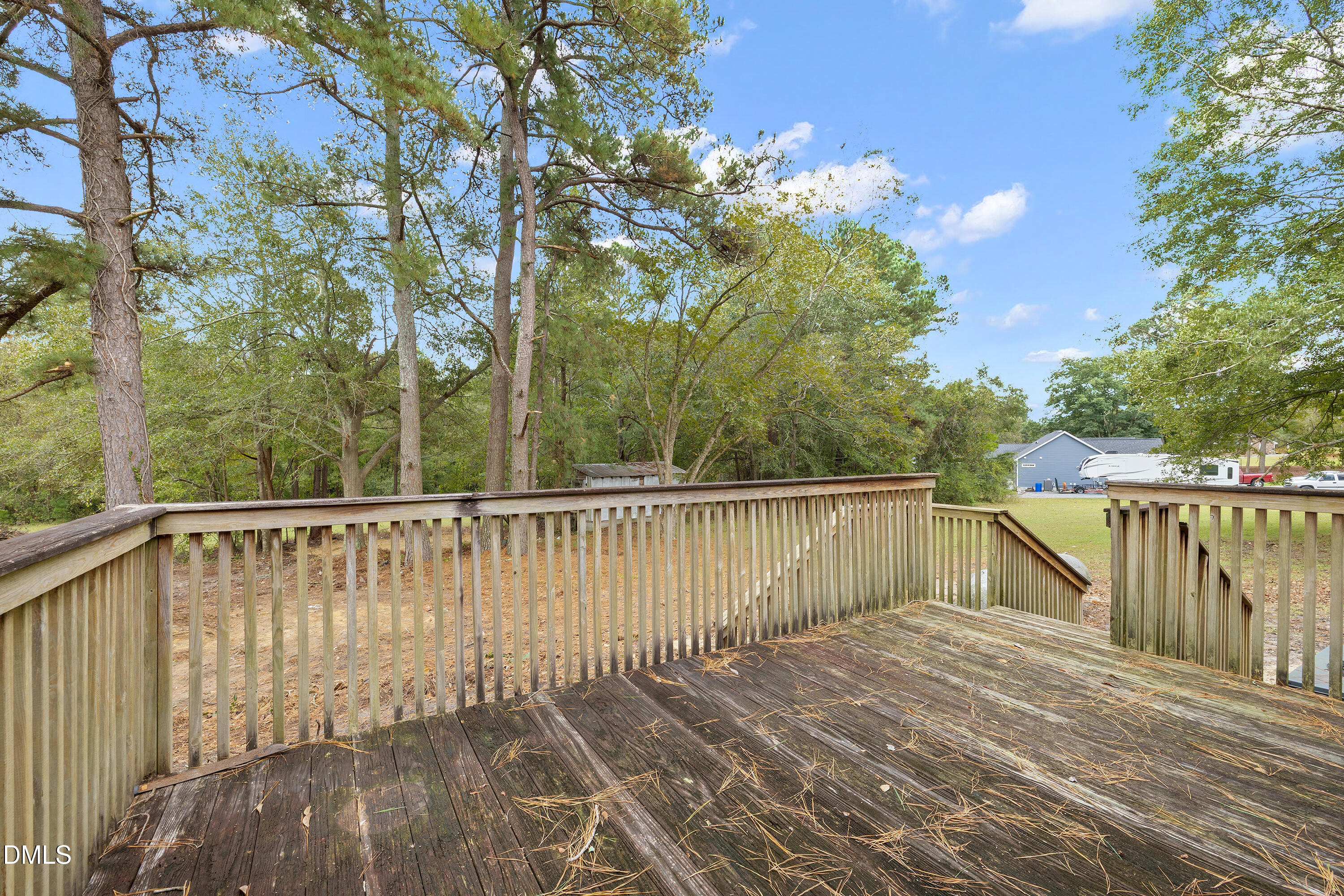 821 Penny Road Angier, NC 27501 - Photo 18 of 25 a balcony with wooden floor and fence