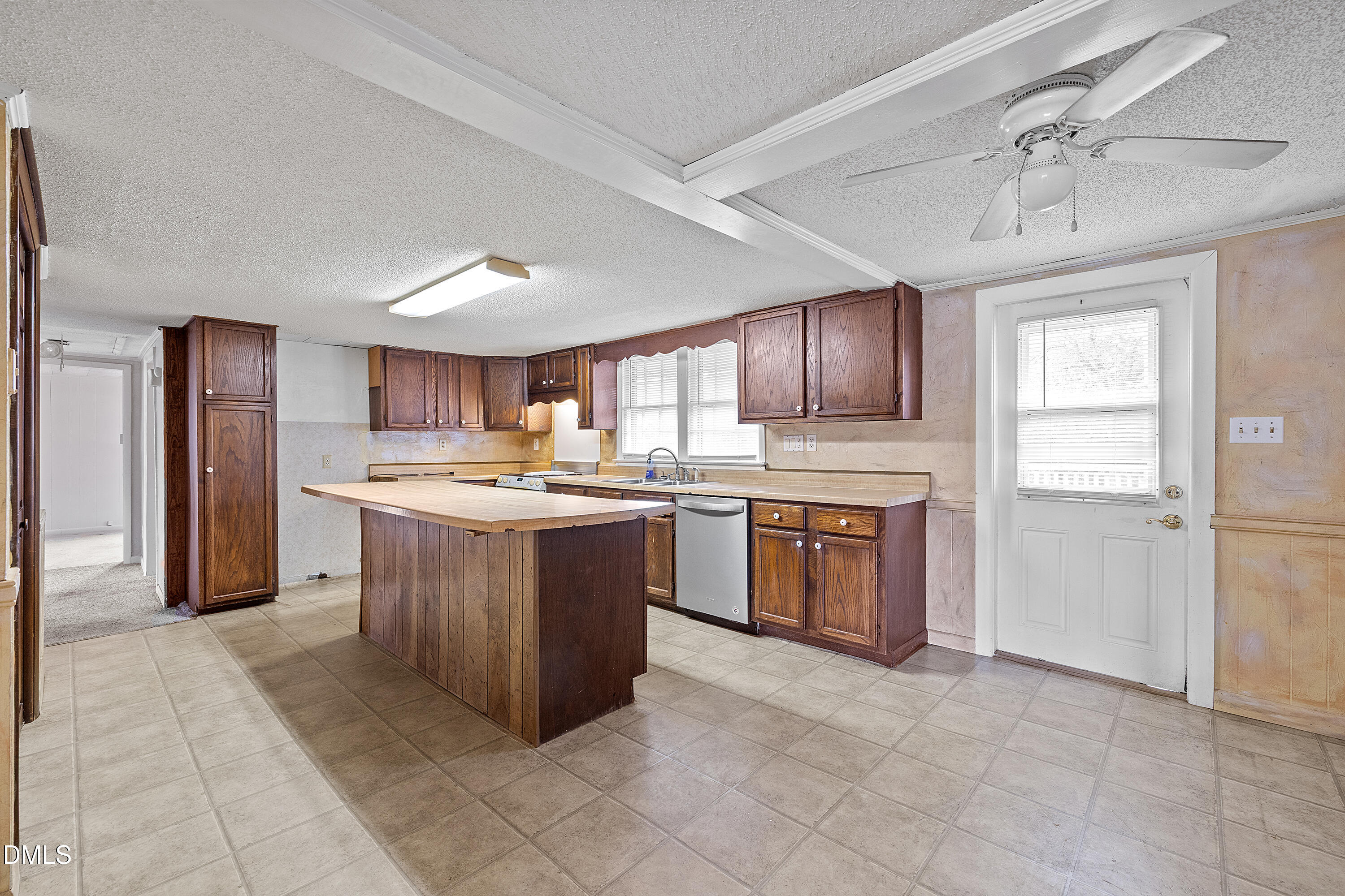 821 Penny Road Angier, NC 27501 - Photo 7 of 25 a kitchen with stainless steel appliances granite countertop a stove refrigerator and a sink