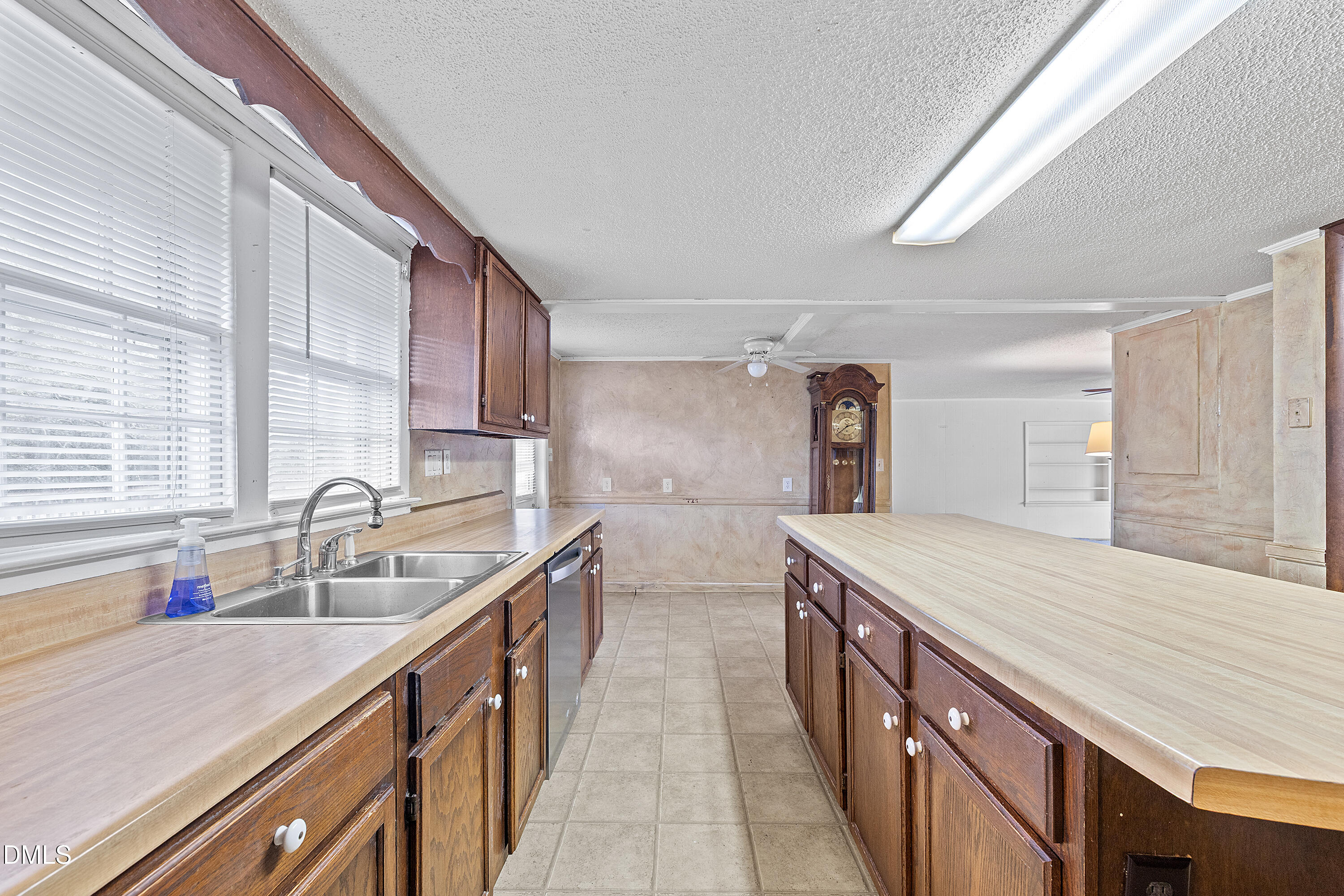 821 Penny Road Angier, NC 27501 - Photo 9 of 25 a kitchen with two sink and cabinets