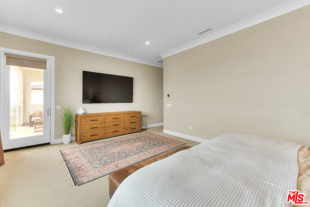 20558 Overlook Court Porter Ranch, CA 91326 - Photo 20 of 48 a bedroom with a bed and a flat screen tv