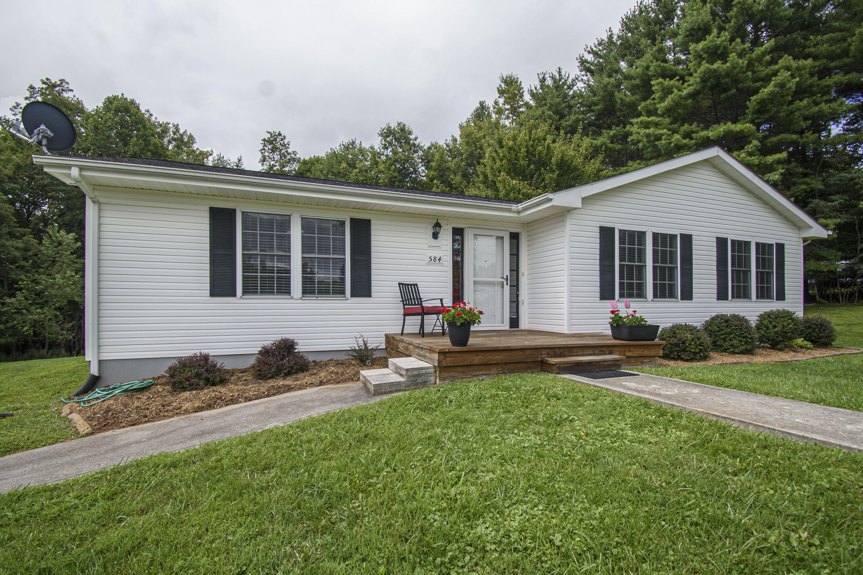 584 Kings Store Road Northeast Floyd, VA 24091 - Photo 1 of 51 a view of a house with backyard and sitting area