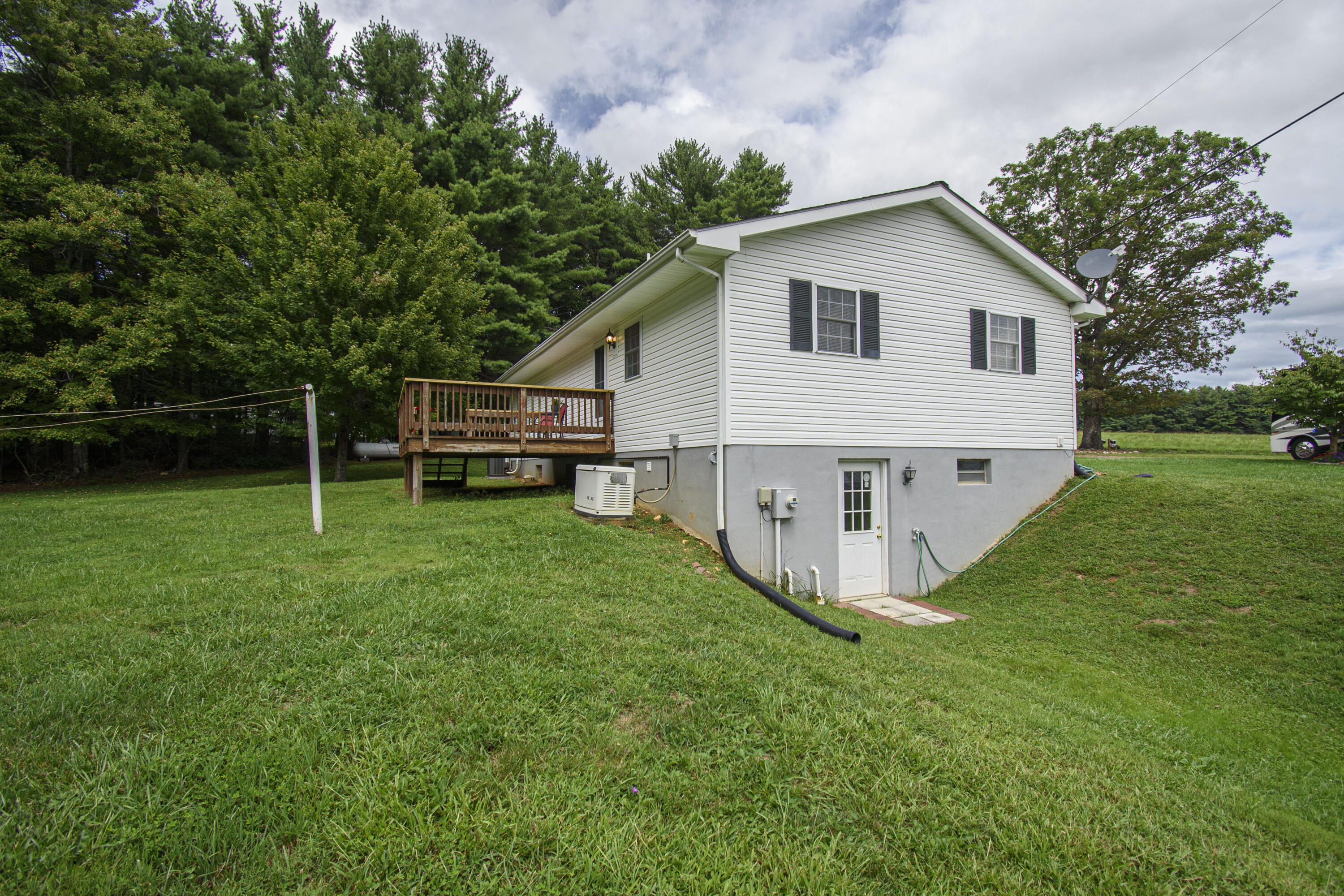 584 Kings Store Road Northeast Floyd, VA 24091 - Photo 11 of 51 a view of a house with a yard and sitting area