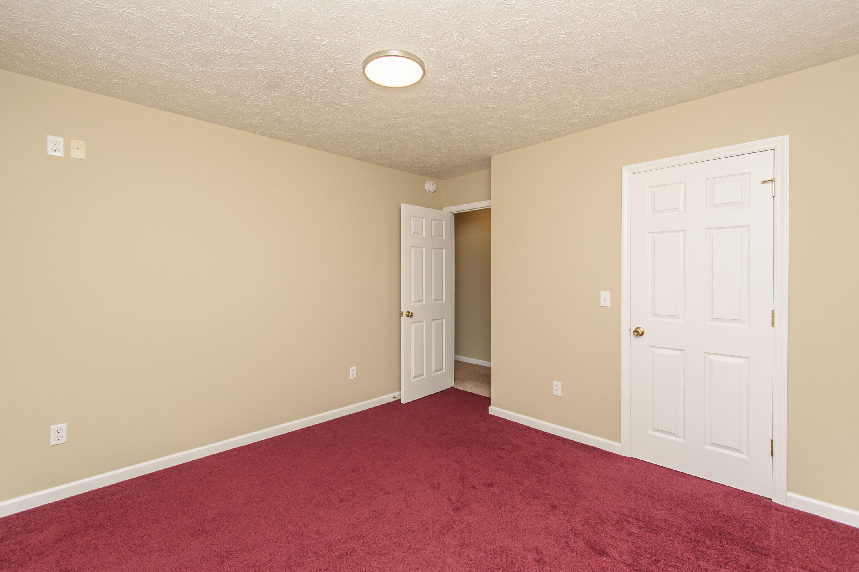 584 Kings Store Road Northeast Floyd, VA 24091 - Photo 29 of 51 an empty room with wooden floor and windows