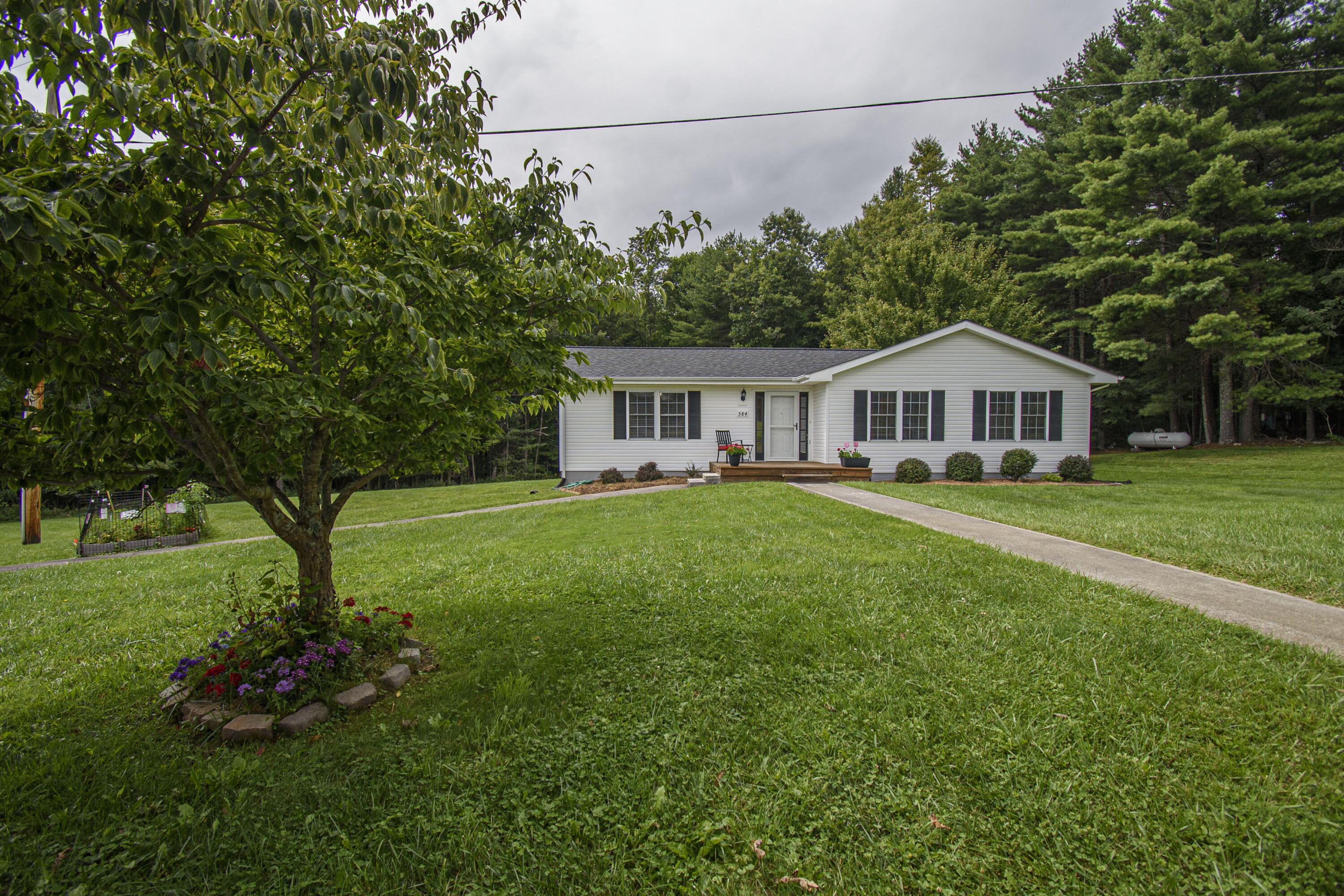 584 Kings Store Road Northeast Floyd, VA 24091 - Photo 4 of 51 a house view with a garden space