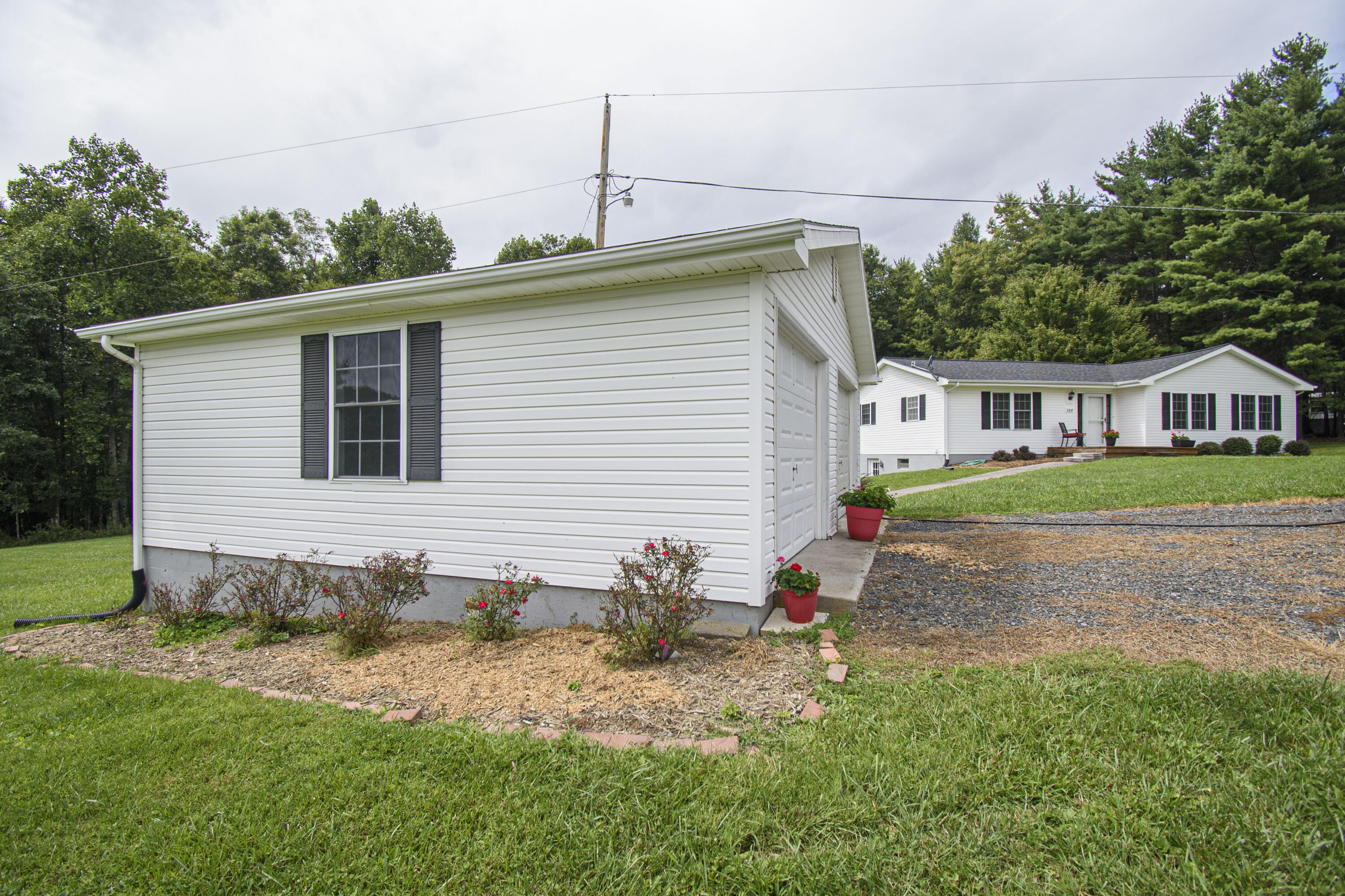 584 Kings Store Road Northeast Floyd, VA 24091 - Photo 42 of 51 a front view of a house with garden