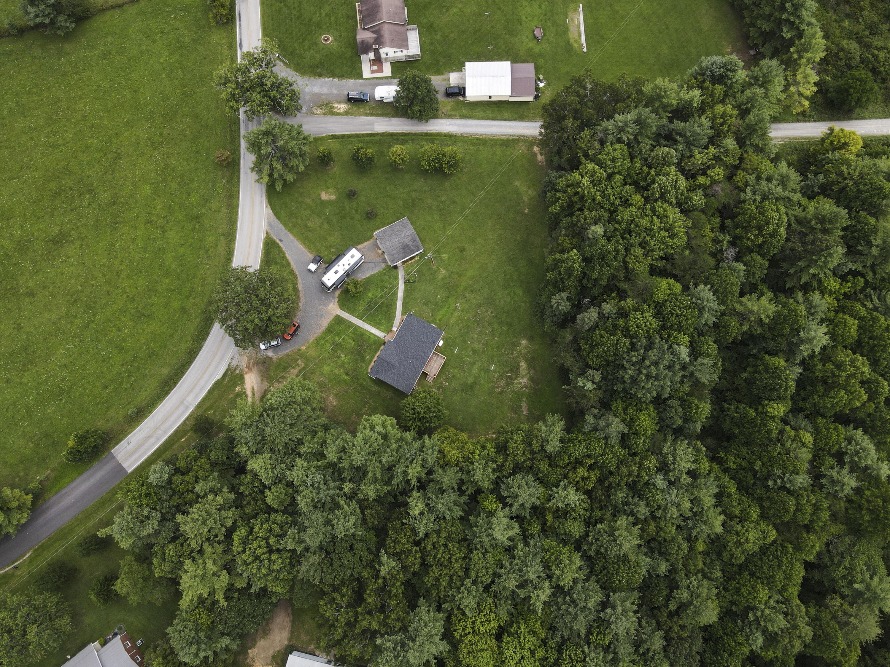 584 Kings Store Road Northeast Floyd, VA 24091 - Photo 50 of 51 an aerial view of a house with a yard basket ball court and outdoor seating