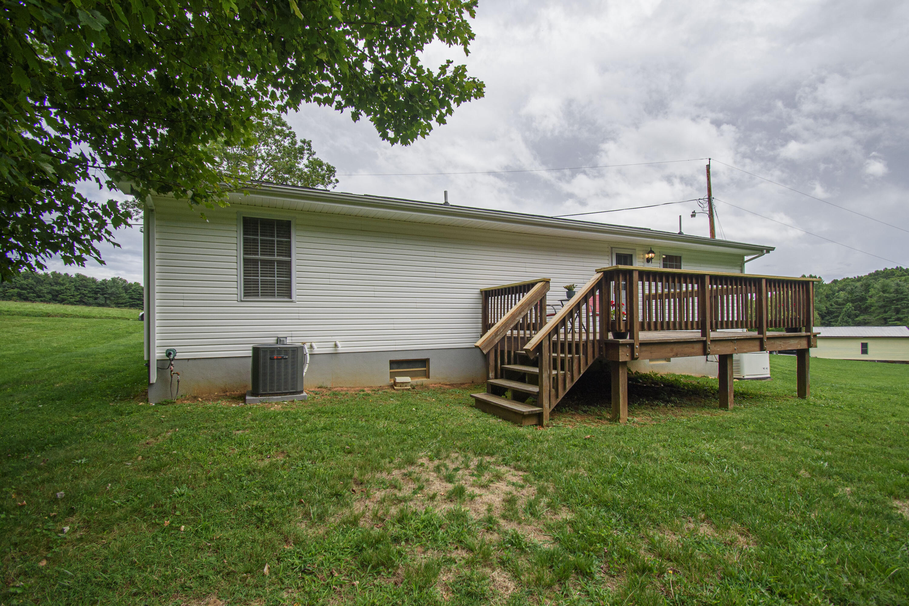 584 Kings Store Road Northeast Floyd, VA 24091 - Photo 6 of 51 a front view of a house with garden