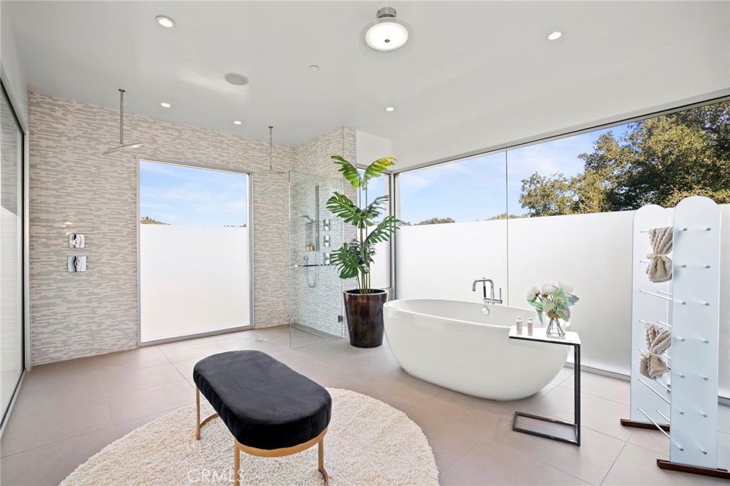 9716 Oak Pass Road Beverly Hills, CA 90210 - Photo 45 of 63 a living room with furniture and a potted plant