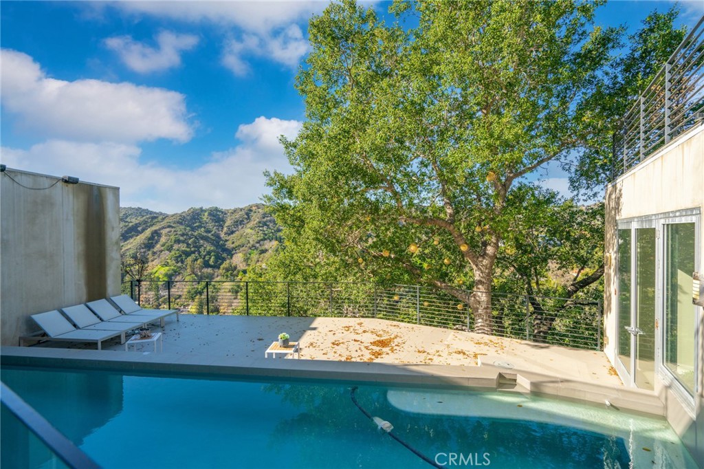 9716 Oak Pass Road Beverly Hills, CA 90210 - Photo 56 of 63 a view of a balcony with yard