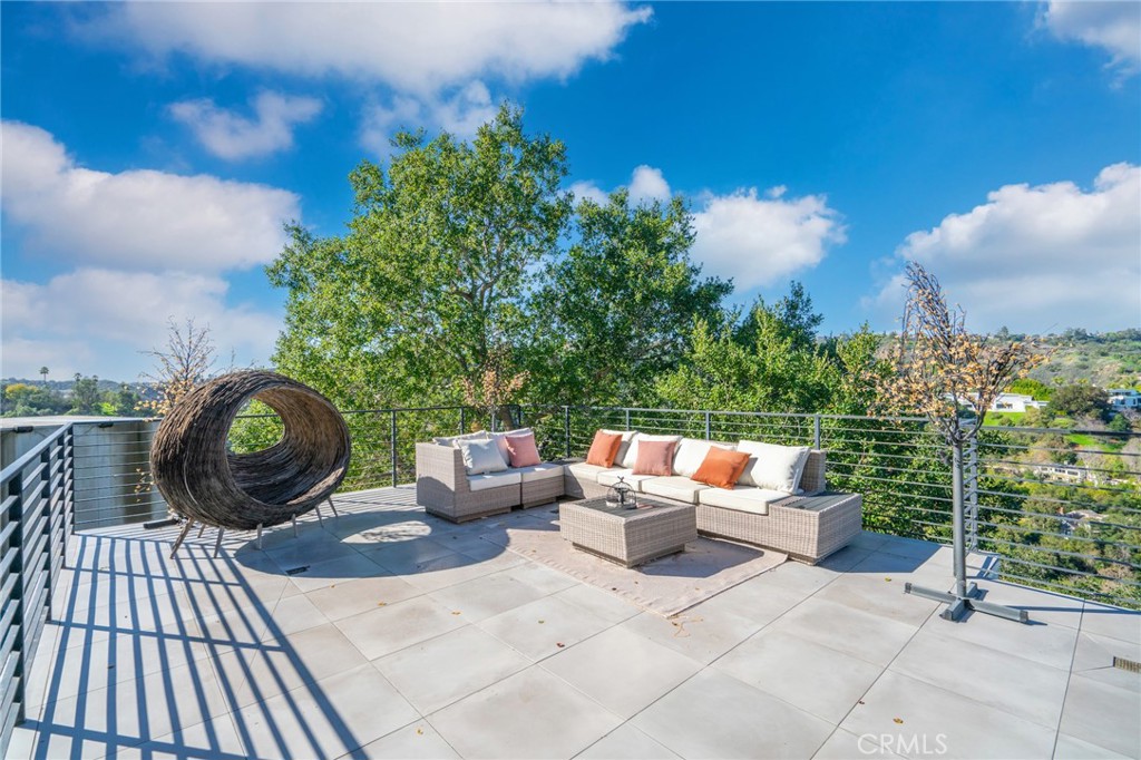 9716 Oak Pass Road Beverly Hills, CA 90210 - Photo 62 of 63 a backyard of a house with outdoor seating