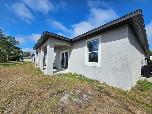 a house with yard in front of it