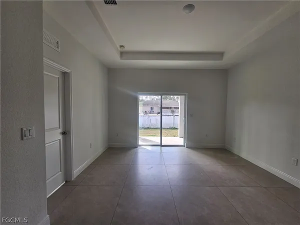 a view of an empty room with a window