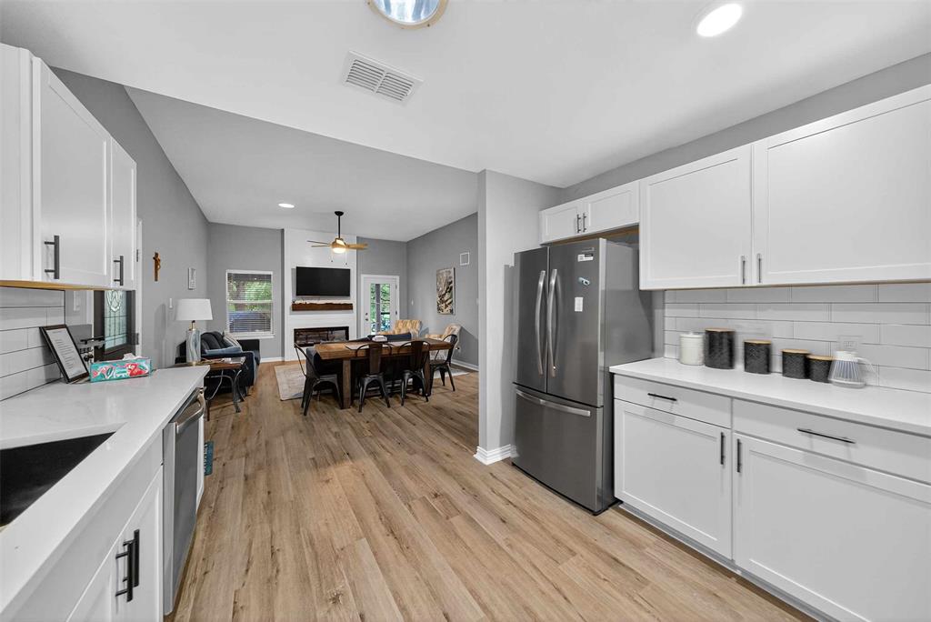 128 Armada Loop Payne Springs, TX 75156 - Photo 12 of 33 a kitchen with stainless steel appliances a refrigerator sink and cabinets