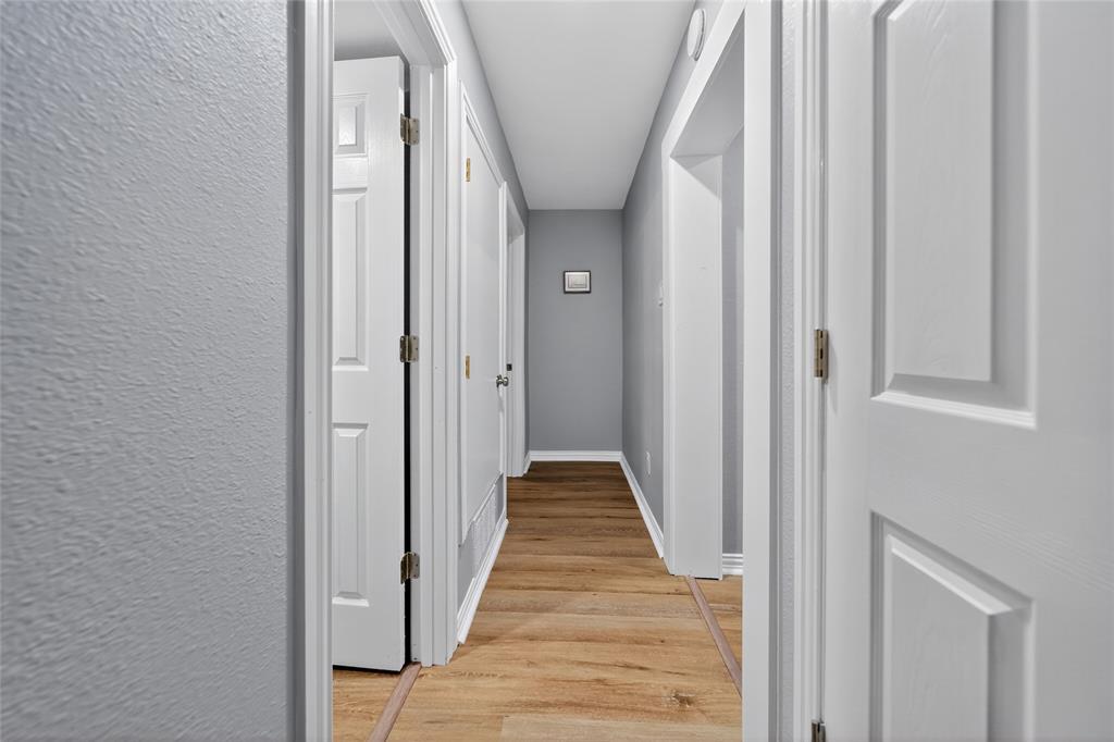 128 Armada Loop Payne Springs, TX 75156 - Photo 15 of 33 a view of a hallway with wooden floor and entryway