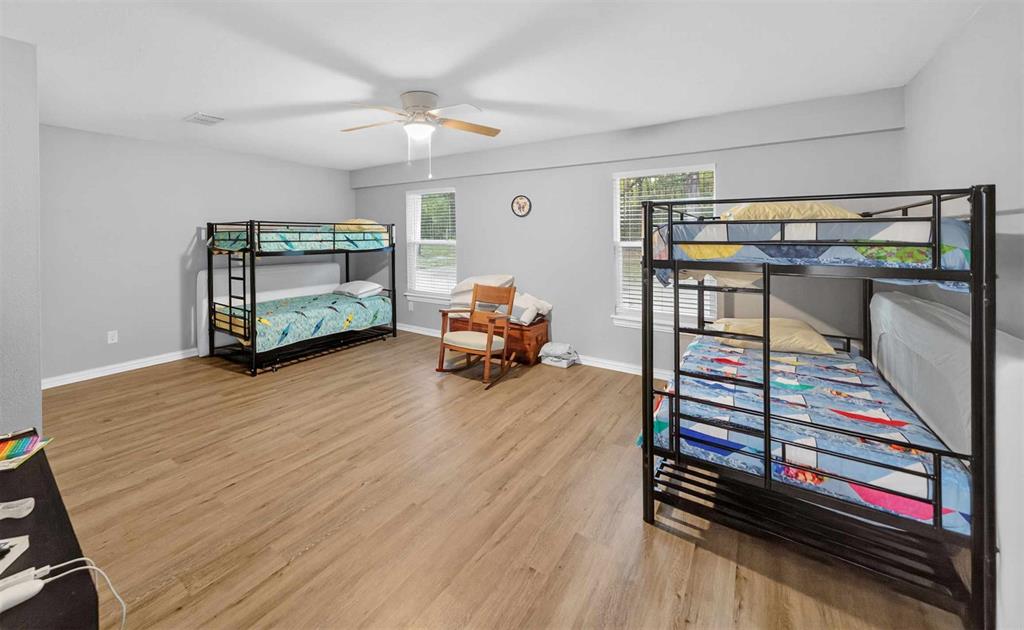 128 Armada Loop Payne Springs, TX 75156 - Photo 21 of 33 a living room with furniture and a wooden floor