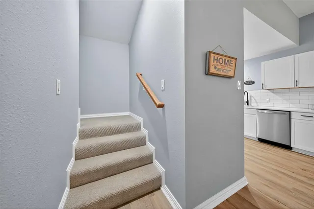 a view of kitchen with furniture and wooden floor