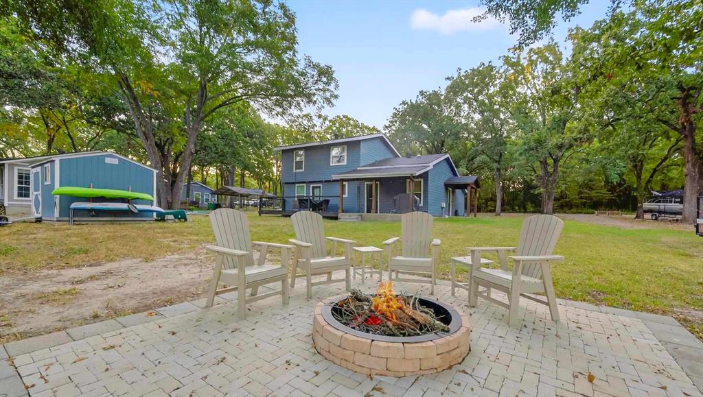 128 Armada Loop Payne Springs, TX 75156 - Photo 3 of 33 a view of a house with backyard and sitting area