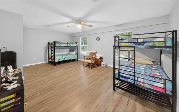 a bedroom with furniture and a window