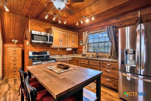 820 County Road 339 Moody, TX 76557 - Photo 12 of 36 a kitchen with a table chairs stove and refrigerator