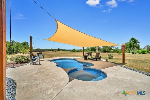 820 County Road 339 Moody, TX 76557 - Photo 25 of 36 a view of a swimming pool and lounge chairs
