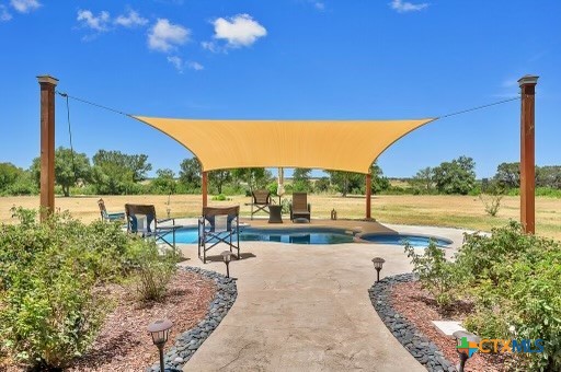 820 County Road 339 Moody, TX 76557 - Photo 26 of 36 a view of a swimming pool with a patio
