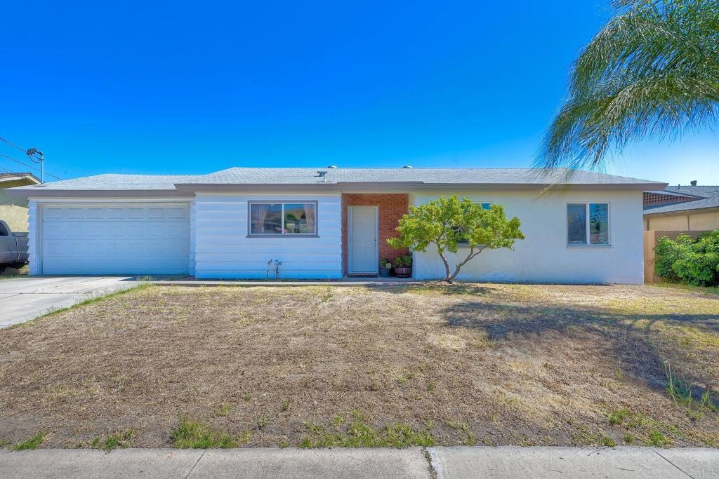 9451 Terrywood Road Santee, CA 92071 - Photo 1 of 1 a front view of a house with a yard and garage