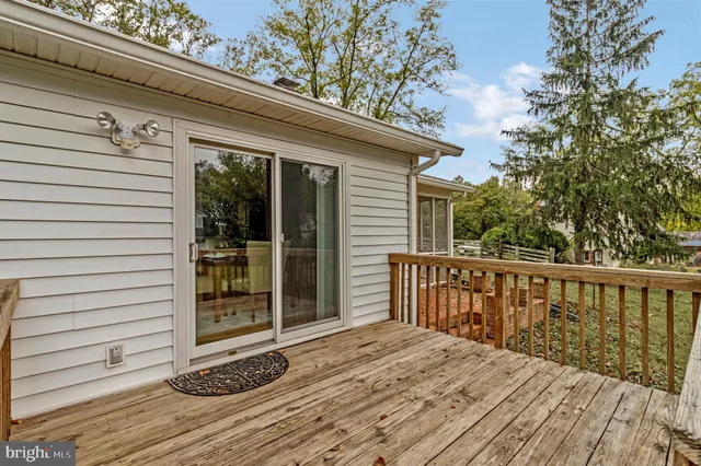 a view of backyard with a deck