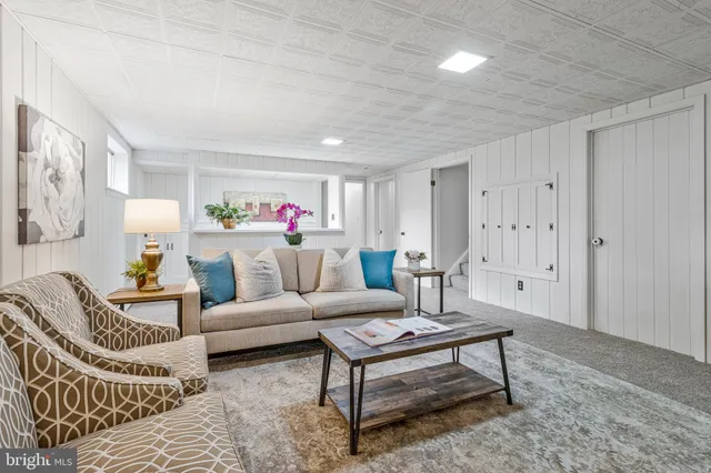 a living room with furniture and a rug