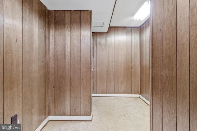 a view of an empty room with wooden walls