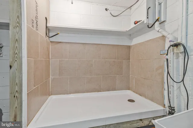 a bathroom with a shower and a bathtub