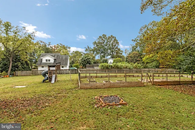 a swimming pool with an outdoor seating and yard
