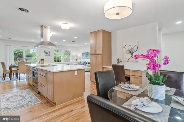 a kitchen with a table and chairs