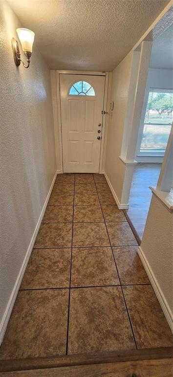 1900 Apple Valley Road Plano, TX 75023 - Photo 12 of 32 a view of a room with wooden floor and white walls