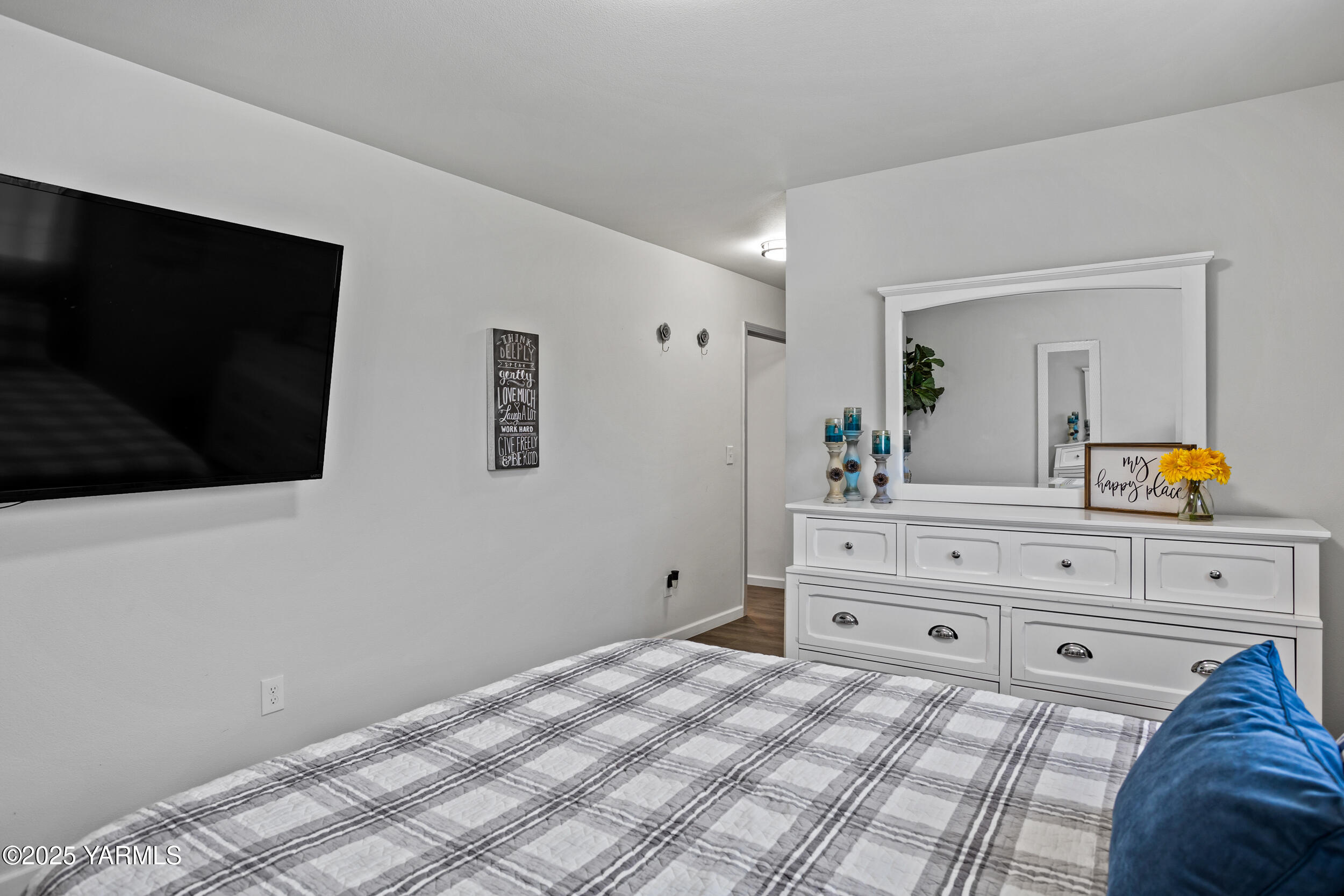 3485 Selah Loop Road Selah, WA 98942 - Photo 11 of 38 a bedroom with a bed and a flat screen tv