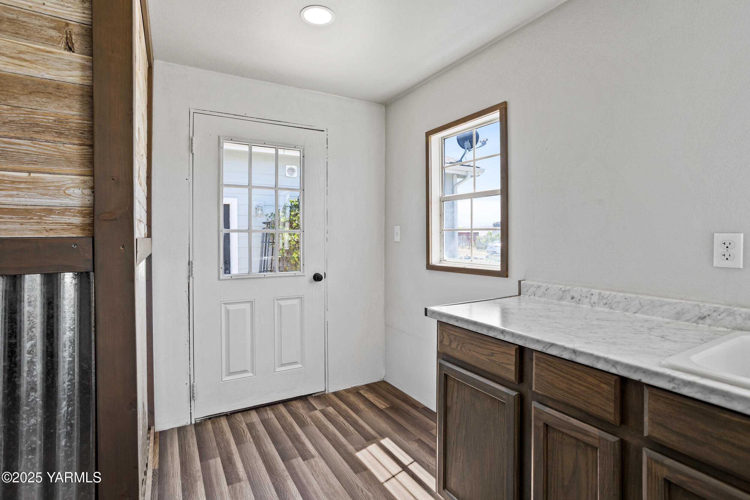 3485 Selah Loop Road Selah, WA 98942 - Photo 23 of 38 a room that has a window and wooden floor