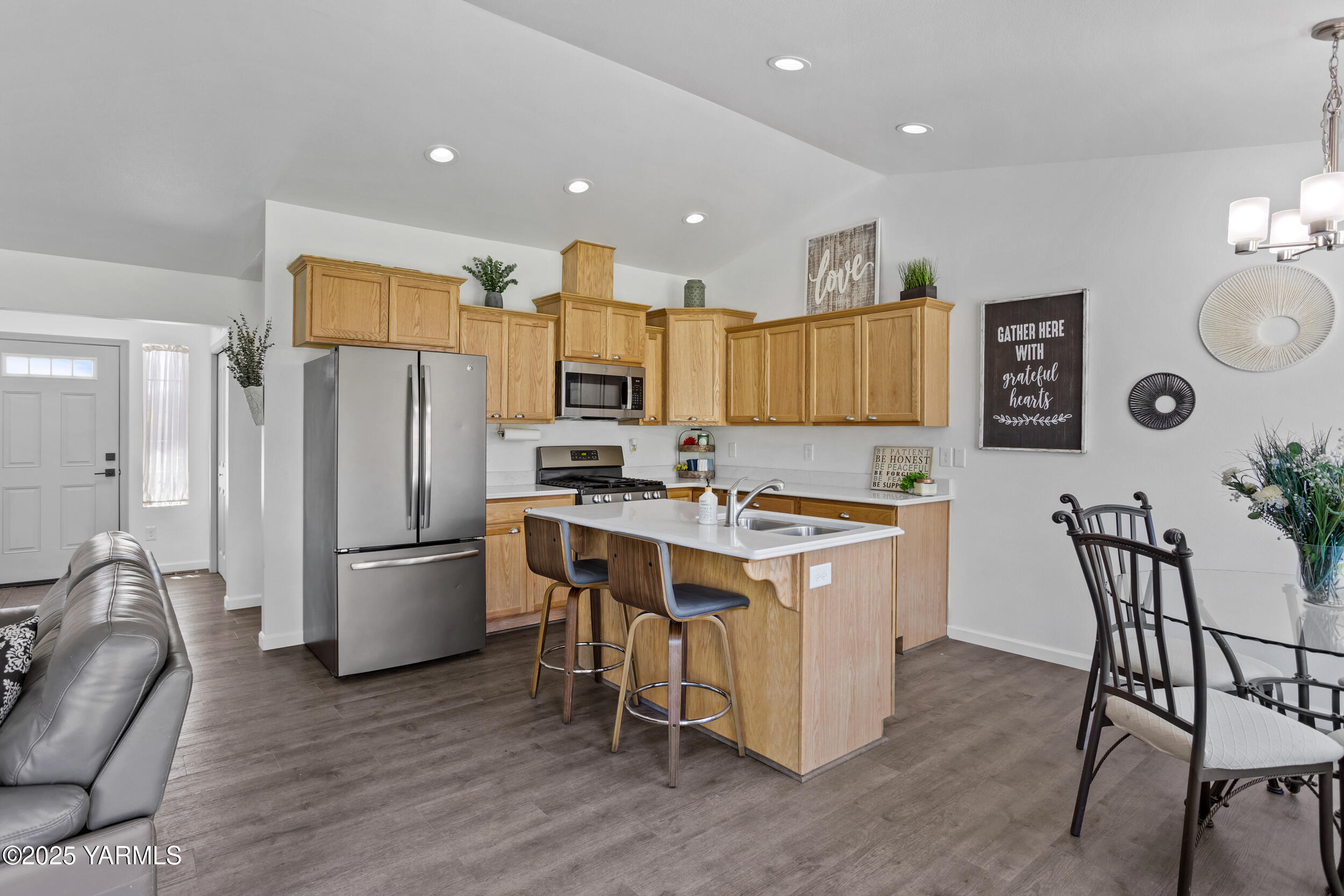3485 Selah Loop Road Selah, WA 98942 - Photo 6 of 38 a kitchen with a refrigerator and a stove top oven