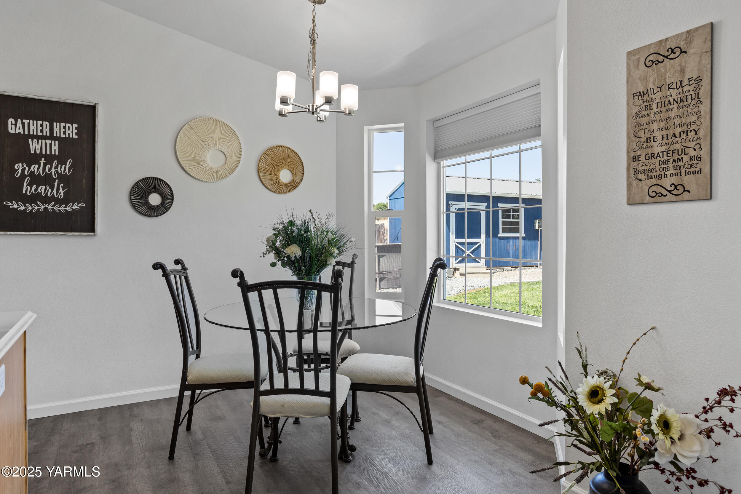 3485 Selah Loop Road Selah, WA 98942 - Photo 7 of 38 a view of a dining room with furniture and chandelier