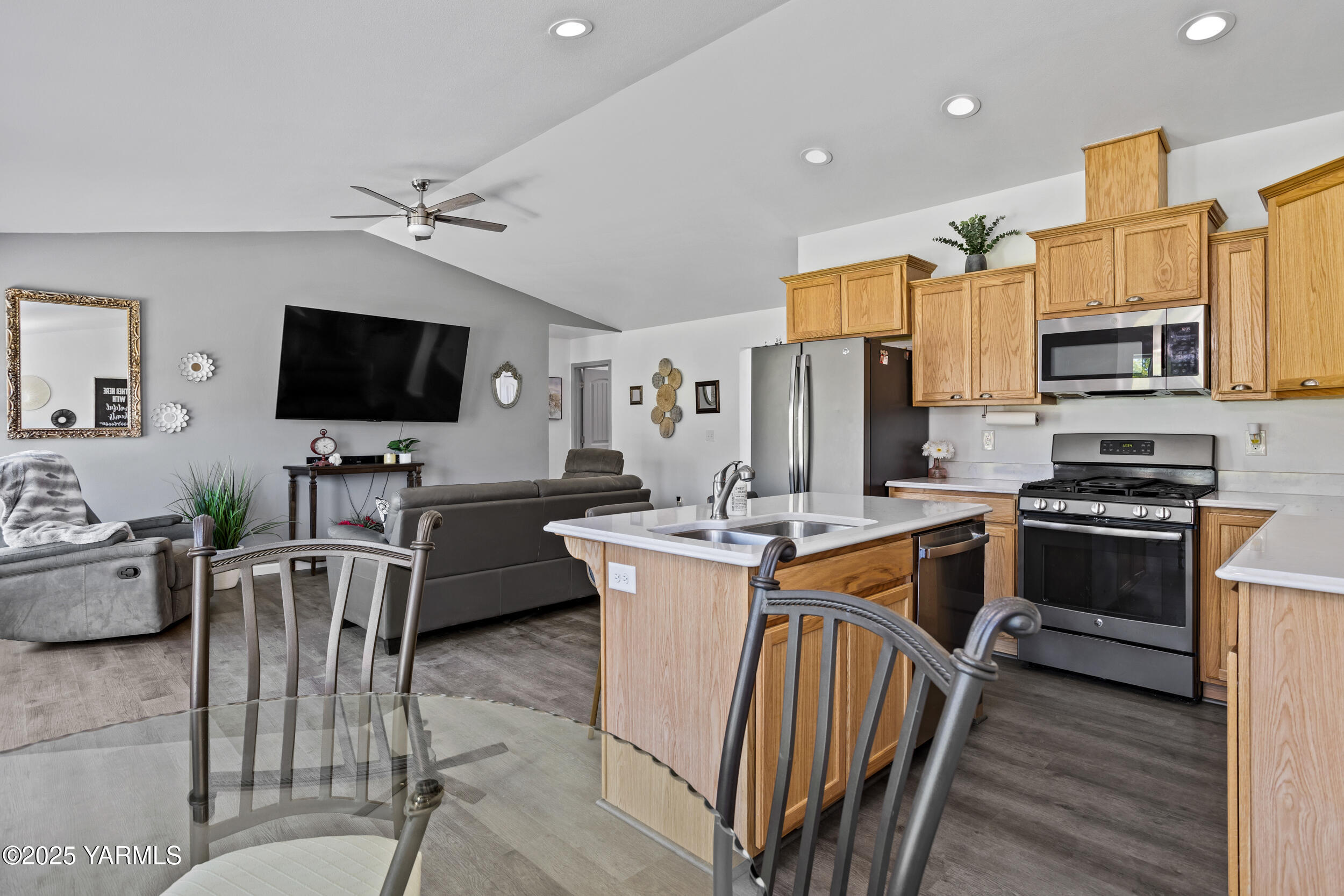 3485 Selah Loop Road Selah, WA 98942 - Photo 8 of 38 a living room with stainless steel appliances furniture a flat screen tv and kitchen view