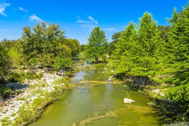 a view of lake with green space