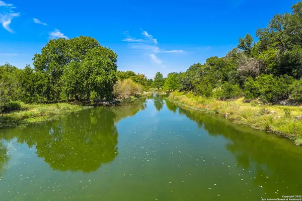a view of a lake with houses in outdoor space