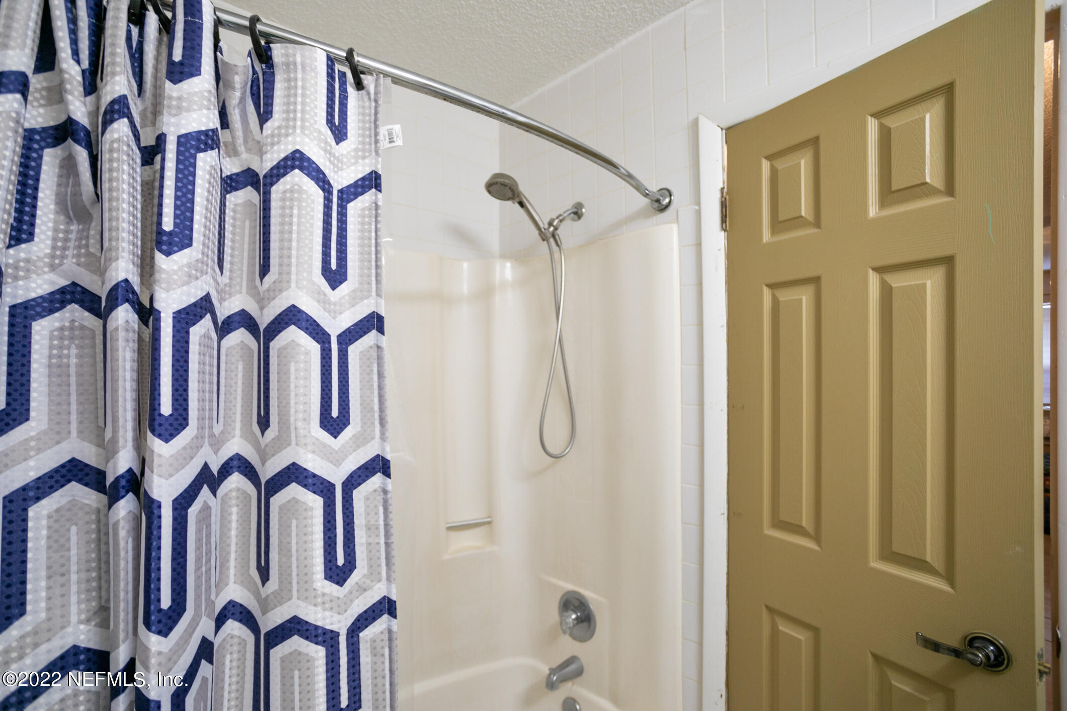 3150 Ricky Drive Jacksonville, FL 32223 - Photo 11 of 28 a bathroom with a bathtub and shower