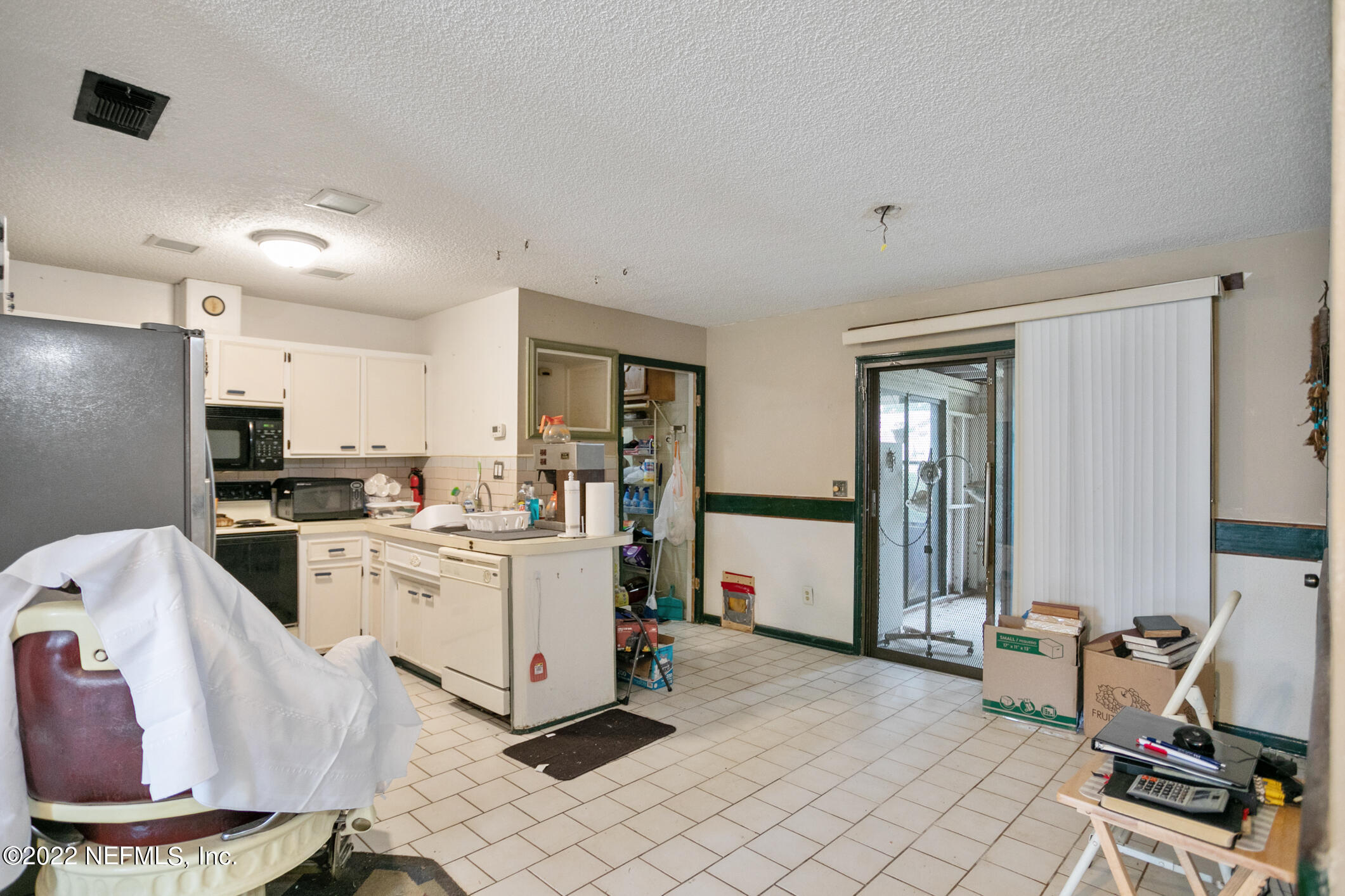 3150 Ricky Drive Jacksonville, FL 32223 - Photo 12 of 28 a kitchen with a sink appliances and cabinets