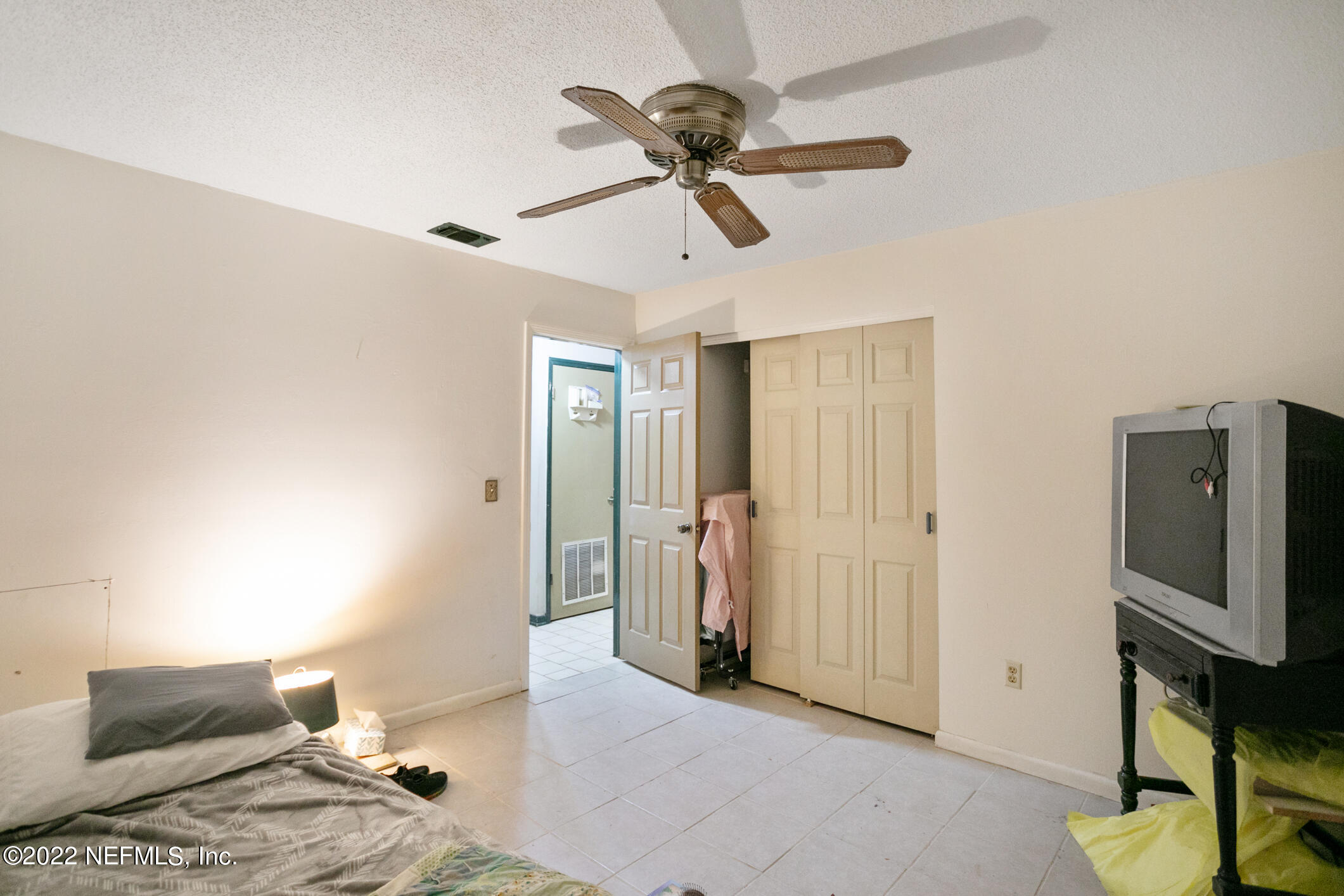3150 Ricky Drive Jacksonville, FL 32223 - Photo 18 of 28 a view of a livingroom with furniture and a ceiling fan
