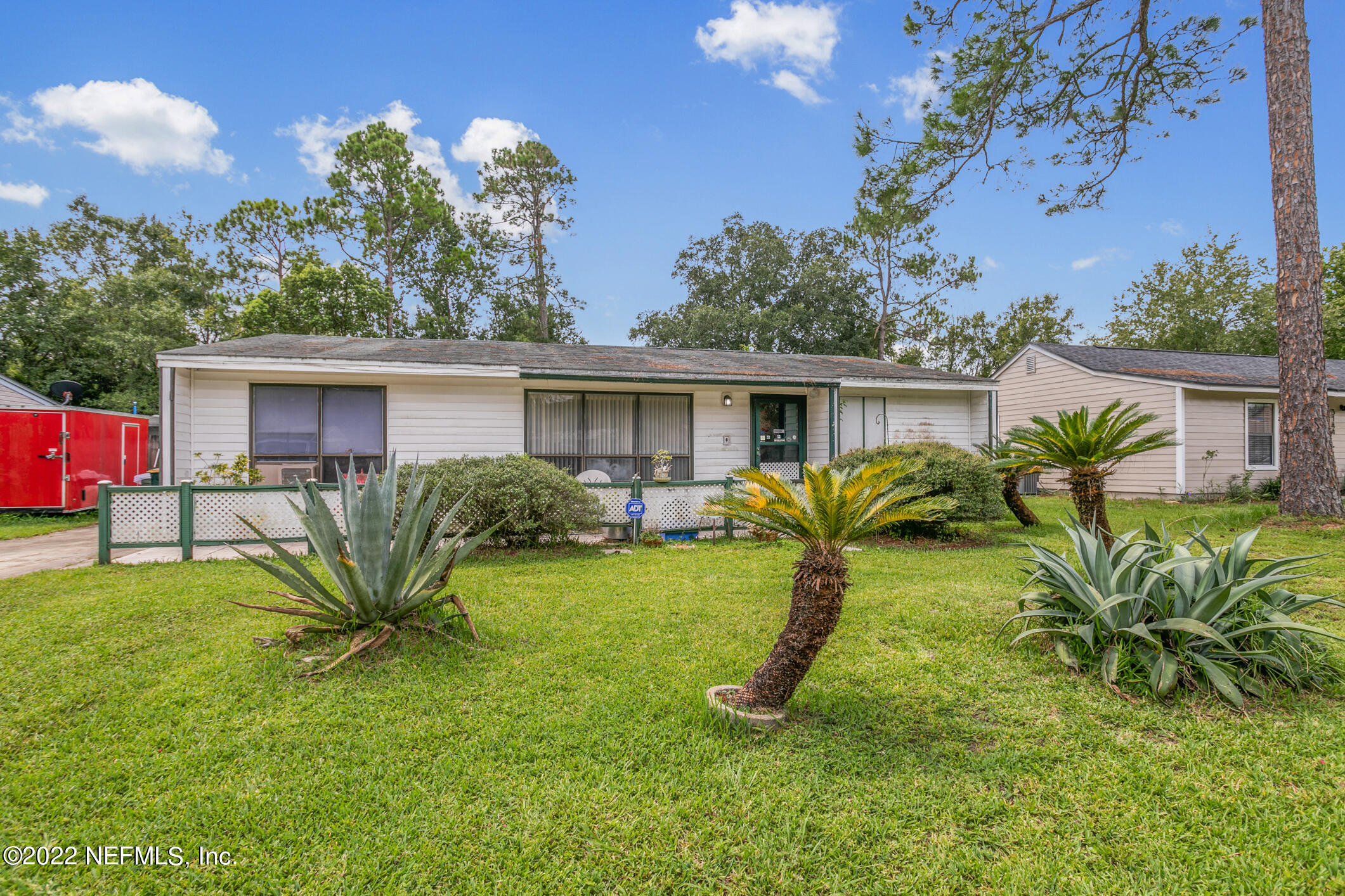 3150 Ricky Drive Jacksonville, FL 32223 - Photo 2 of 28 a view of a house with a backyard and a patio