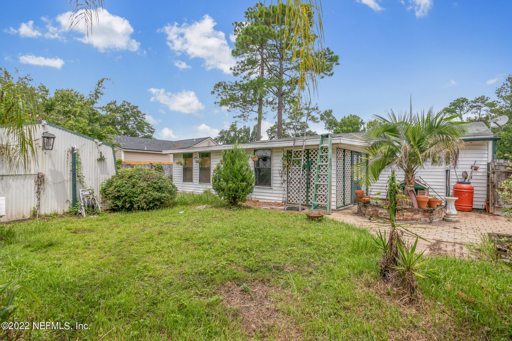3150 Ricky Drive Jacksonville, FL 32223 - Photo 28 of 28 a front view of a house with a yard and garage